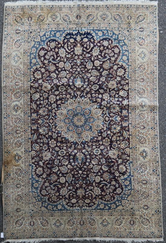 An Isfahan carpet, 8ft 4in by 4ft 8in.